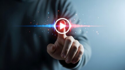 Person interacting with a glowing play button on a digital interface with finger