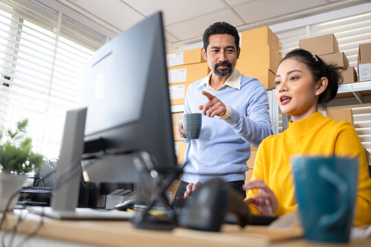 Happy warehouse team coffee break and checking order processing in small business fulfillment office