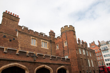 Historic Brick Building With Towers in Urban Setting on a Cloudy Day in London