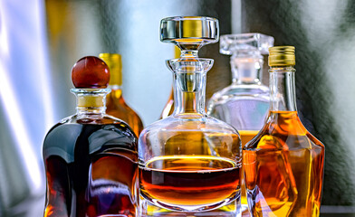 Bottles and carafes of assorted alcoholic beverages