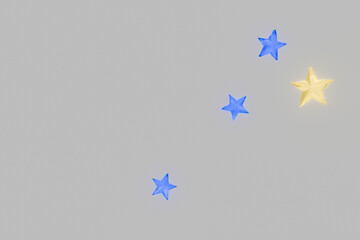 灰色の背景に青色と黄色の星