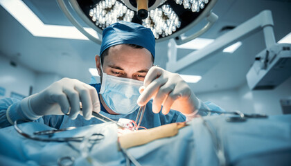 A focused surgeon in an operating room performs a critical medical procedure with utmost precision, highlighting modern healthcare expertise and lifesaving technology.