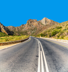 A view up the road in the Cogmans Kloof gorge in the Langeberg mountain range near in Ashton, South Africa in springtime