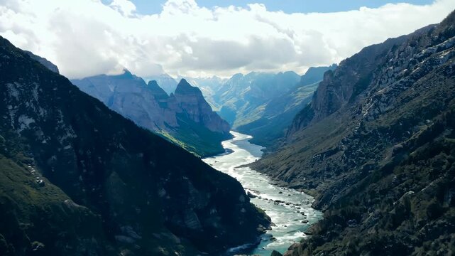 A breathtaking view of a mountain valley with a winding river under a clear blue sky. towering peaks and lush slopes frame the scene, creating a serene and majestic landscape perfect for wall art, pri