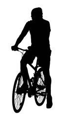 Obraz premium Young adult man riding a vintage bicycle outdoors on a sunny day.