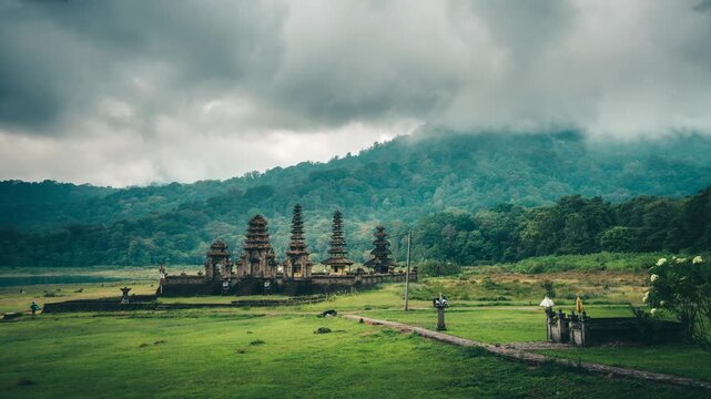 traditional balinese Pura Ulun temple on the morning lake in Bali, Indonesia, Indonesian culture, foggy sunrise on a lake in Bali