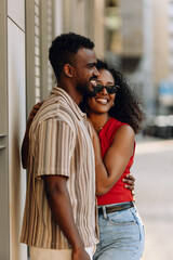 Naklejka premium A man and woman hug and laugh while standing