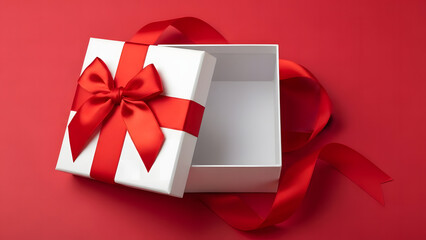 Gift box with open lid and red ribbon