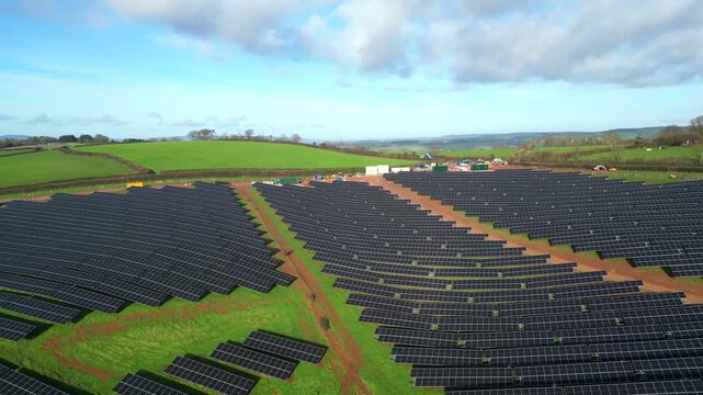 Coffinswell, South Devon, England: DRONE VIEWS: A solar panel farm surrounded by open countryside and farmland. Solar power is an integral part of the UK government's strategy for achieving net zero.