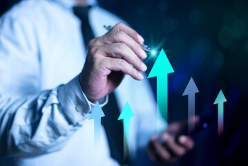 Businessman hands pointing at growing upward arrows, symbolizing growth, increase, Company growth and increase concept