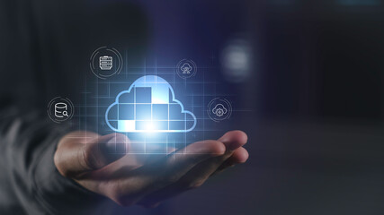 Cloud data storage and digital transformation concept. Hand holding cloud computing icon with...