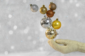 Girl holding Christmas balls in her hand.Christmas background.