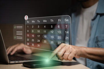 Time management concept showing a person planning tasks using a digital calendar and checklist on laptop, emphasizing scheduling efficiency, productivity tools, and online reminders for business goals