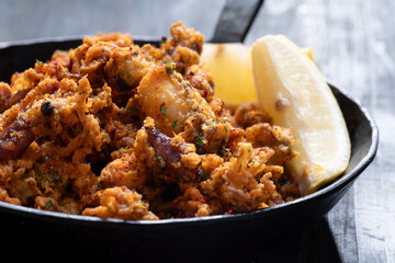 pan of crispy fried baby calamari side dish