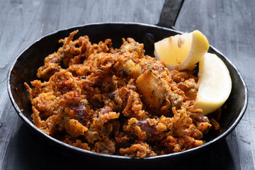 pan of crispy fried baby calamari side dish