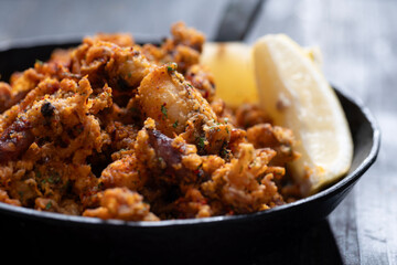 pan of crispy fried baby calamari side dish
