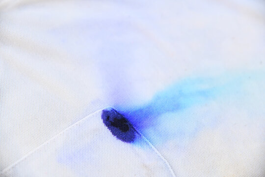 blue blue ink dirty stain  on white shirt for cleaning concept idea in work house