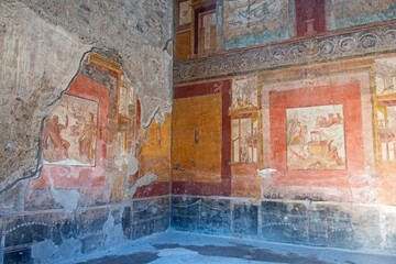 Interior detail of ancient Roman villa with artwork on the walls