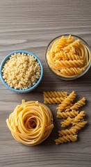 Variety of Uncooked Pasta Shapes on Wooden Surface.