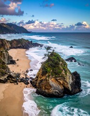 Coastal scene with rocky island and ocean waves under cloudy sky
