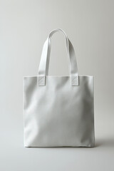 Minimal light gray canvas tote bag isolated on neutral background, perfect for branding mockup, eco shopping concept, sustainable fashion, and reusable everyday accessory.