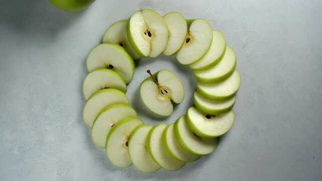 Green apple ring spiral pattern overhead slow orbit