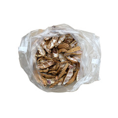 A top view of a plastic bag containing peanut shells.