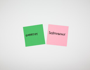 Empathy versus indifference concept shown with colorful sticky notes on white background. Minimalist contrast of human emotions, social values, psychology and emotional awareness.