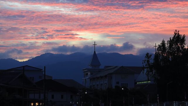 The video background depicts the waterfront, with twilight sky illuminating the riverside community and the lights from houses, reflecting the rural lifestyle of Chanthaburi, Thailand.