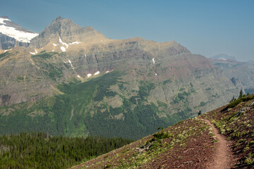 Backpacker Raises Arms In Excitement On The Ptarmigan Trail In Glacier