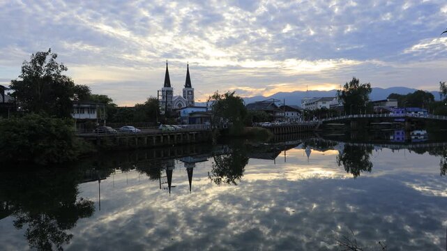 This nighttime video view of the Chanthaburi River in Thailand features a beautiful, historic Catholic church that attracts tourists from all over the world.