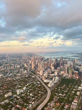 Aerial view of an urban skyline with skyscrapers while flying into Miami airport, Florida, USA