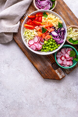 Balanced healthy bowl with vegetables and salmon
