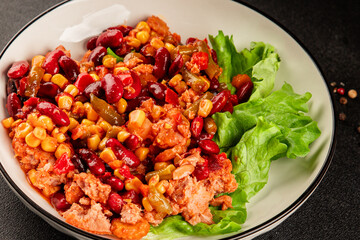 Mexican salad tuna, red beans, corn, peppers, vegetable oil seafood healthy food main course ingredient appetizer fresh tasty food table background country food top view copy space keto and paleo diet