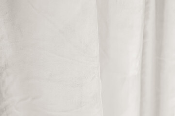 Soft, flowing fabric in the trending color Cloud Dancer, creating a serene and elegant texture