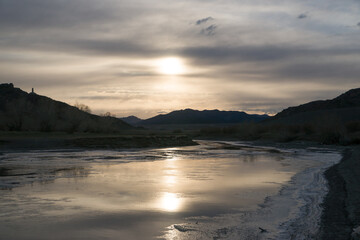 Early spring river bank covered in ice