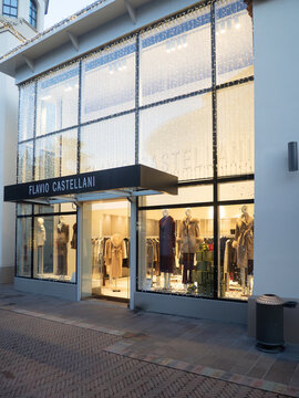 Flavio Castellani boutique in Fidenza Village, Italy, showcasing luxury fashion clothing and products during Christmas