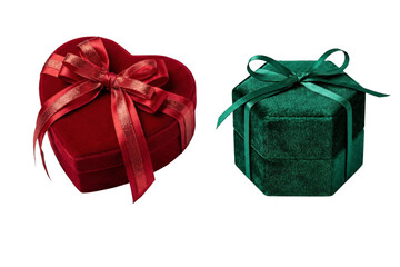Elegant red heart shaped and green hexagonal velvet gift boxes tied with satin bows