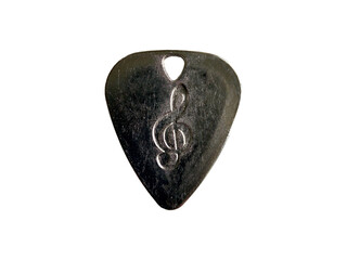 Metal guitar pick with treble clef engraving on transparent background