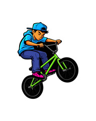 Obraz premium Young boy performing a wheelie on a BMX bicycle with green frame.