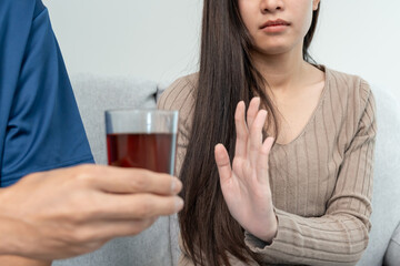 woman refuses say no and avoid to drink an alcohol whiskey, stopping hand sign female, alcoholism...