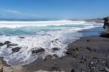 France, La Reunion Island, waves on the windy volcanic coastline 