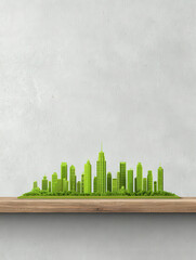 Green miniature cityscape model on wooden shelf with modern buildings and trees