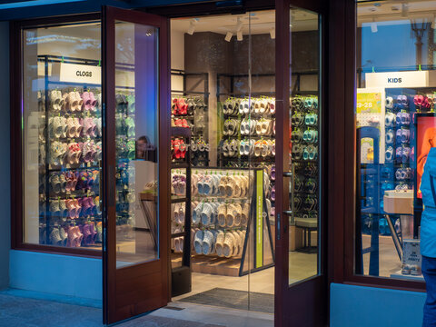 Crocs store entrance in Fidenza Village outlet, colorful clogs and footwear display for shoppers