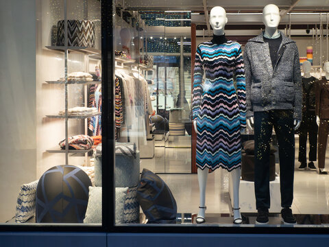 Missoni luxury fashion boutique storefront displaying zigzag knitwear and products for Christmas holidays in Fidenza Village, Italy