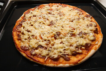 Homemade hot pizza on baking sheet