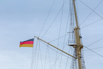 Obraz premium German national flag on historic sailing ship mast