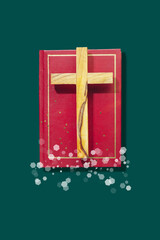 Wooden Religion Cross On Red Bible With Christmas Lights. Spiritual Holiday Visual For Religious Greeting Cards, Faith-Based Content, Church Social Media, And Christian Celebrations