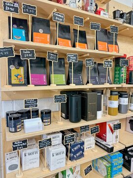 KENDAL, UK - JULY 17, 2025 : Rows of single origin specialty coffees and teas in colorful packaging for sale at Rinaldo's Speciality Coffee and Tea in Kendal, United Kingdom.