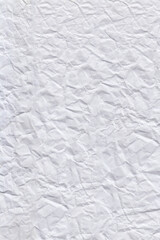 Bright white Paper Texture - A close-up shot of a vibrant white crumpled paper sheet. creative designs, posters, packaging, branding, and modern graphic or abstract layouts
